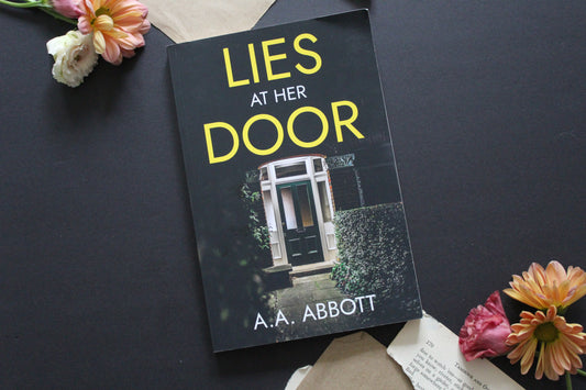 Lies at her Door