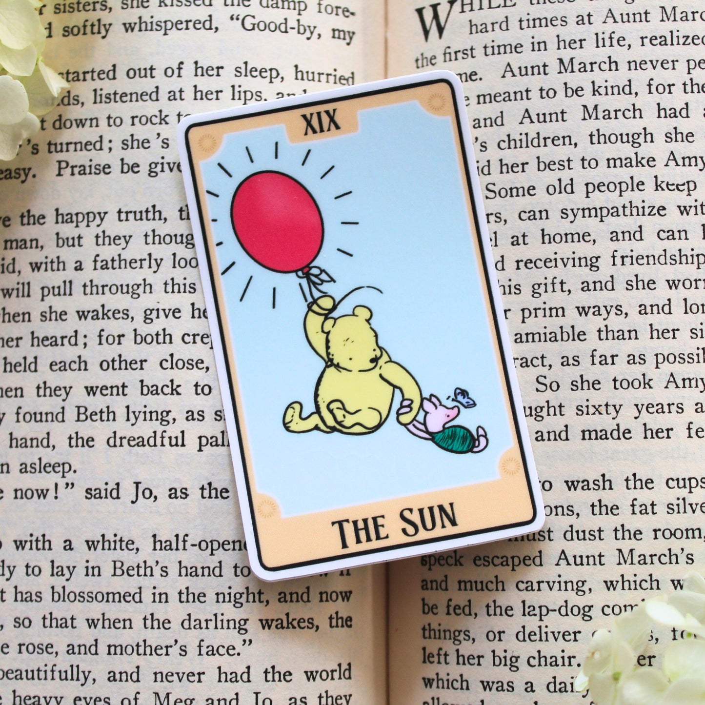 Tarot Card sticker featuring Winnie the Pooh with a red balloon on a book page background